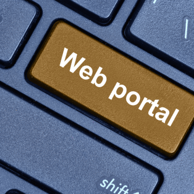 Computer keyboard with a "web portal" button.